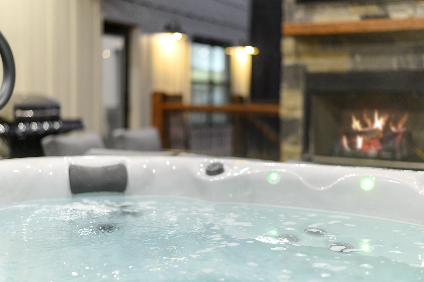 Soak in your private hot tub as the fireplace crackles warmly in the background, creating the perfect atmosphere for ultimate relaxation.