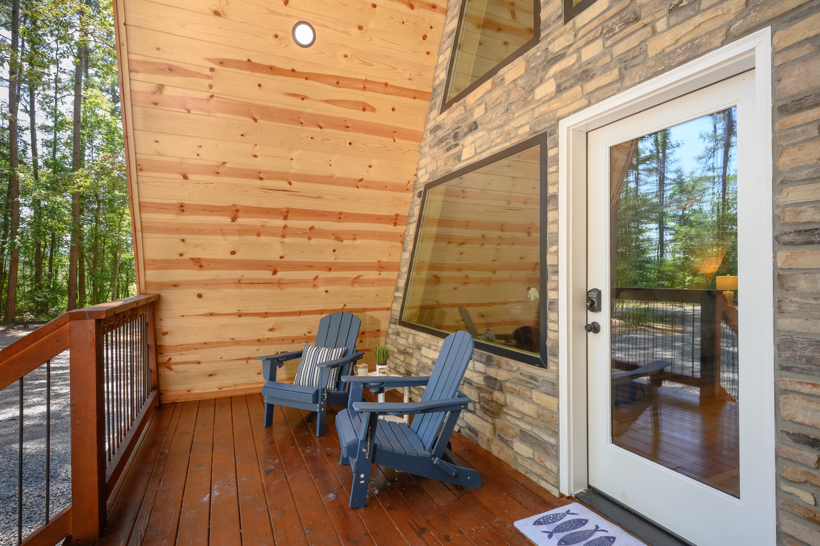 Step onto your private covered deck and settle into cozy Adirondack chairs overlooking the peaceful forest. It's your perfect spot to sip morning coffee or unwind at day's end.