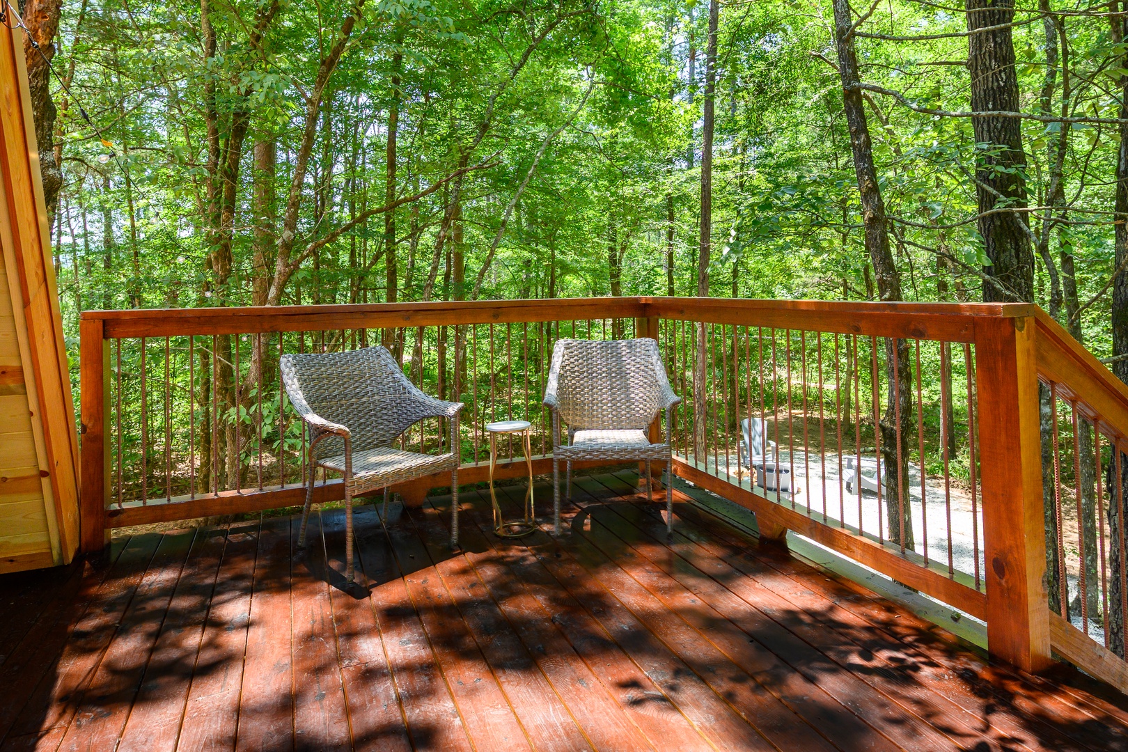 Step out onto your private deck and breathe in the fresh forest air. Two chairs invite you to settle in with your morning coffee or watch the afternoon light dance through the trees around you.