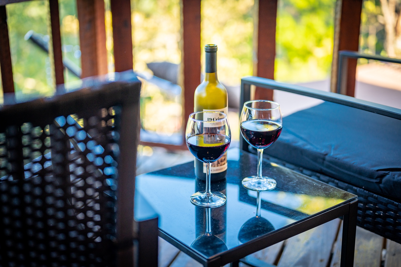 Unwind with your evening wine on your private balcony, where comfortable seating and garden views create the perfect sunset retreat.