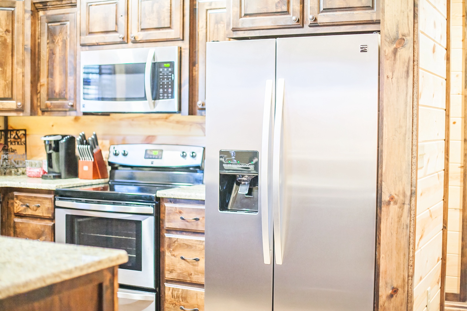 Your rustic kitchen features stainless steel appliances and warm wood cabinetry, creating the perfect space for preparing meals during your stay.