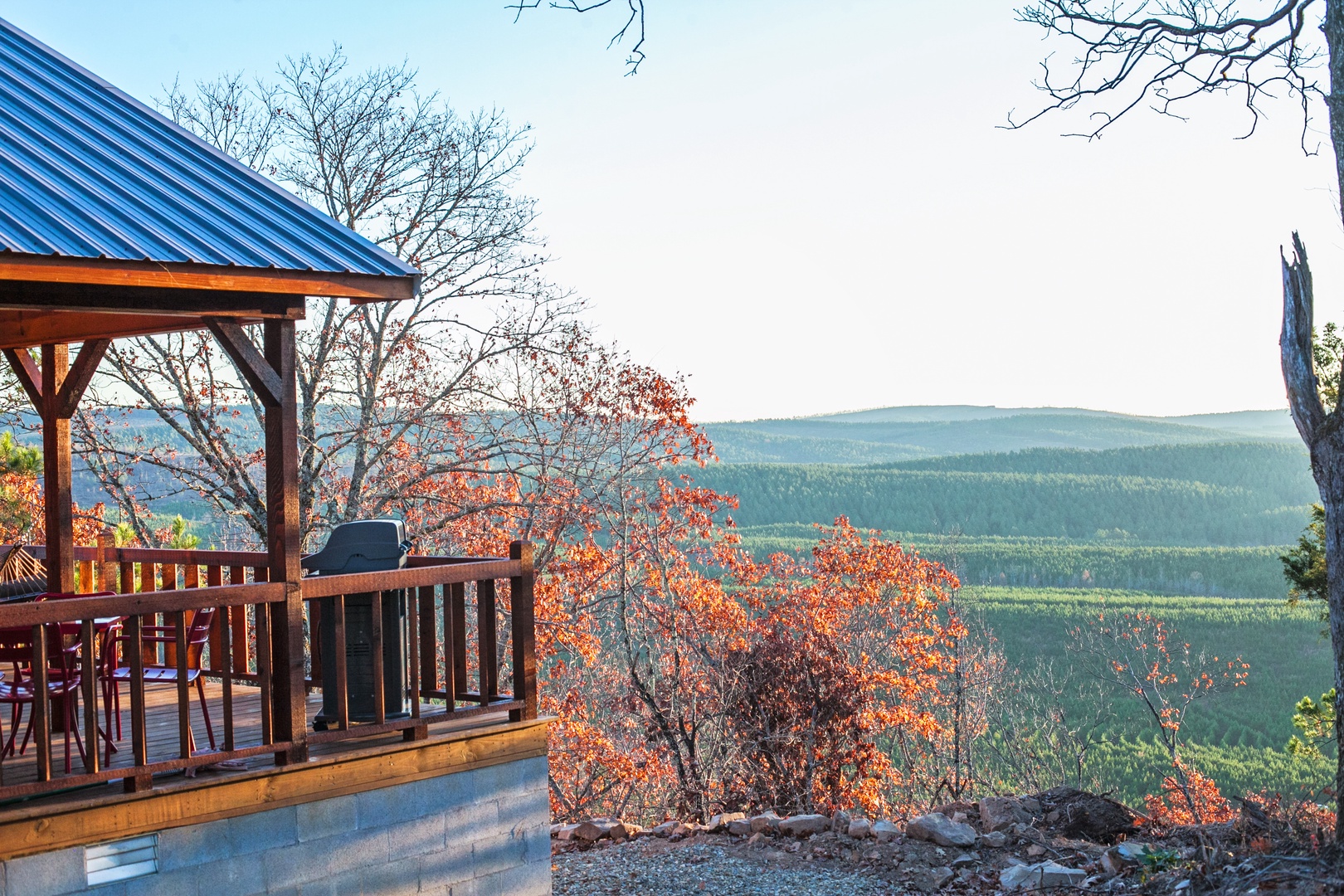 Wake up to breathtaking mountain vistas from your private deck, where autumn colors frame endless forest views and morning coffee tastes even better.
