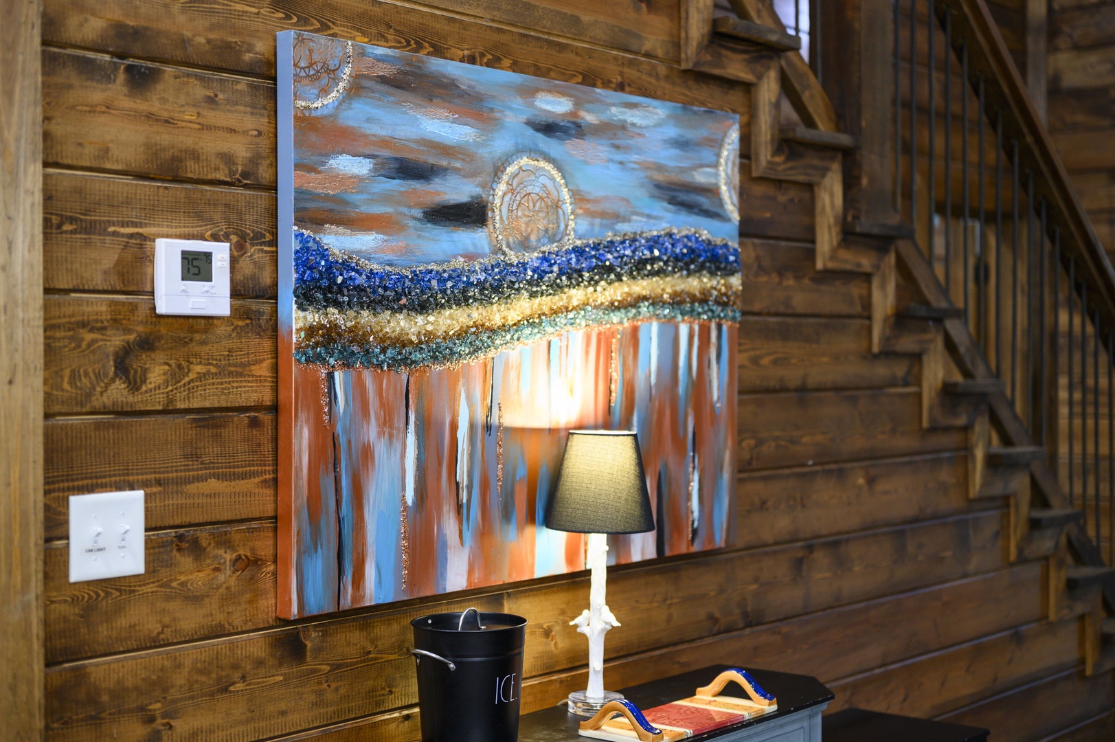 Warm rustic charm welcomes you with rich wood walls, artistic touches, and soft lighting that creates a cozy, inviting atmosphere for your mountain retreat.