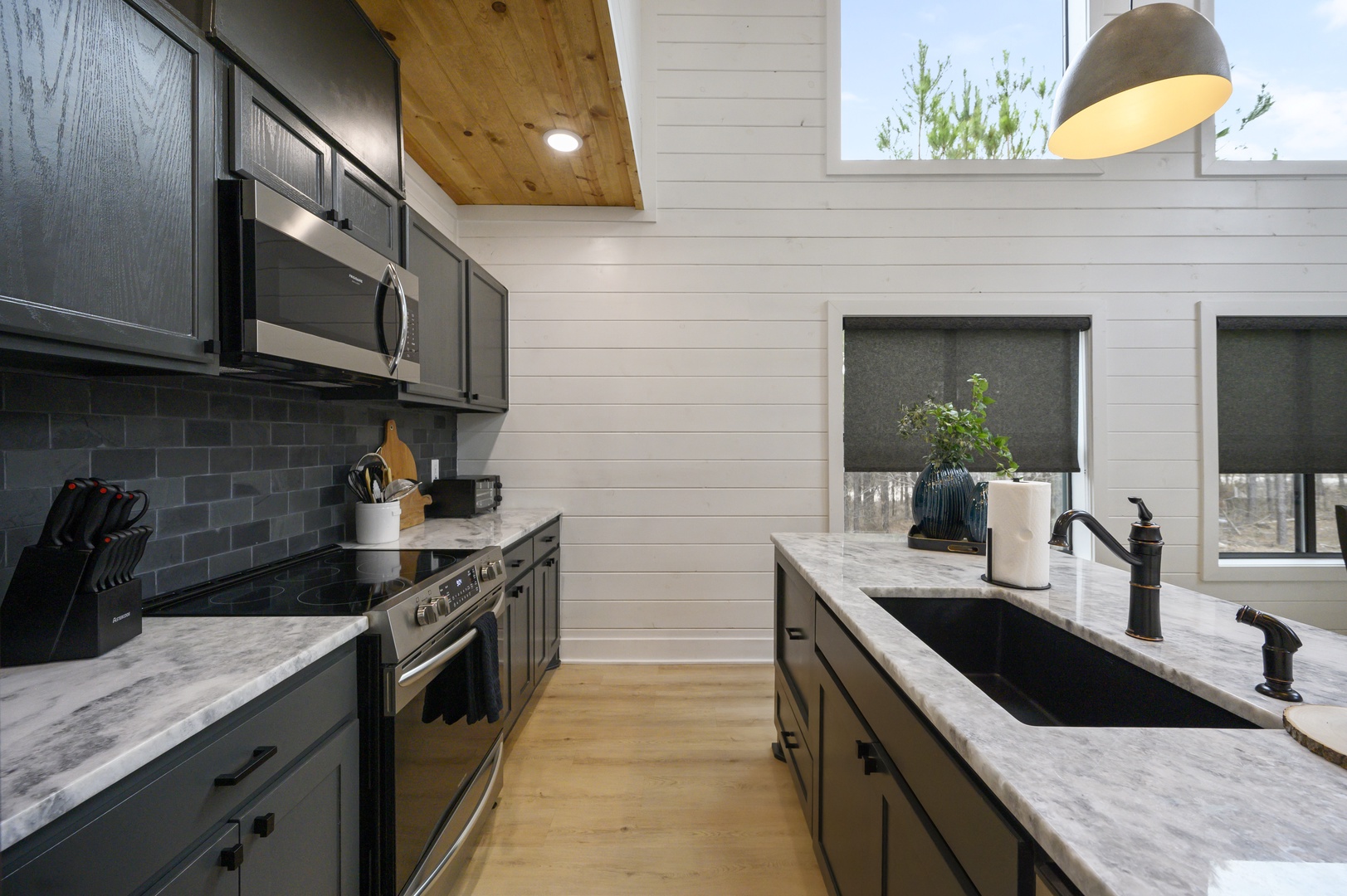 Your fully equipped kitchen features marble countertops, stainless steel appliances, and charming natural light for preparing memorable meals during your stay.