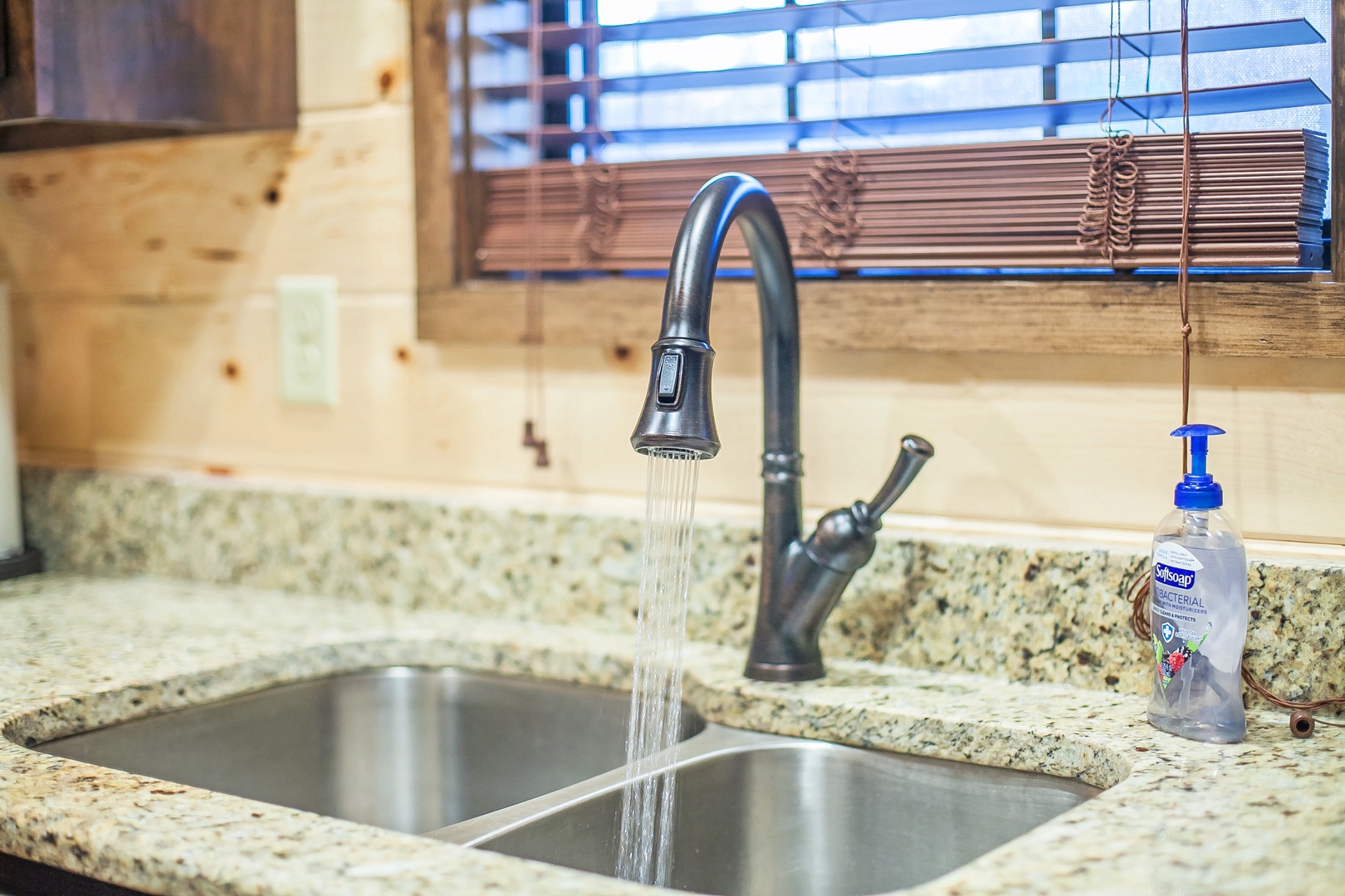 Your modern kitchen features granite countertops and a convenient pull-down faucet for effortless meal prep and cleanup.