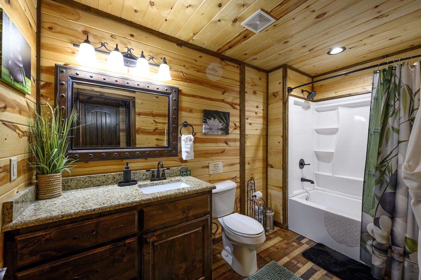 Unwind in your private bathroom with warm wood finishes and rustic charm. The granite vanity and spacious tub-shower combo make it easy to refresh after exploring.