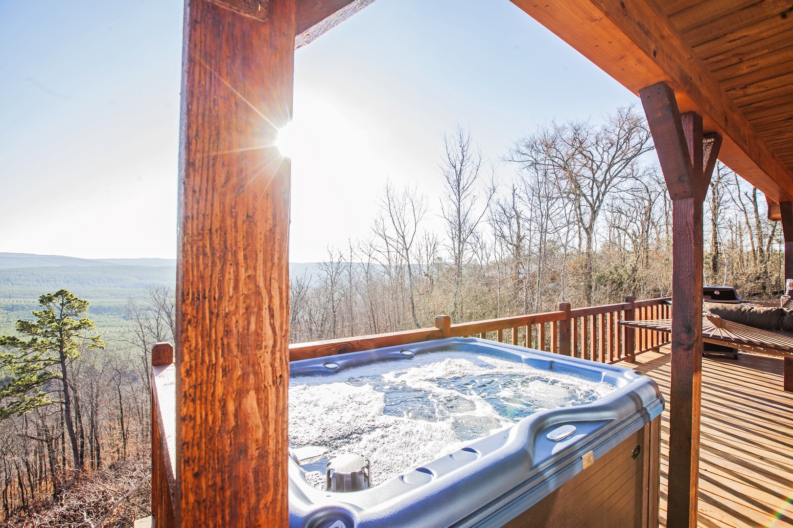 Soak in your private hot tub while mountain vistas stretch endlessly before you, creating the perfect sunset sanctuary.