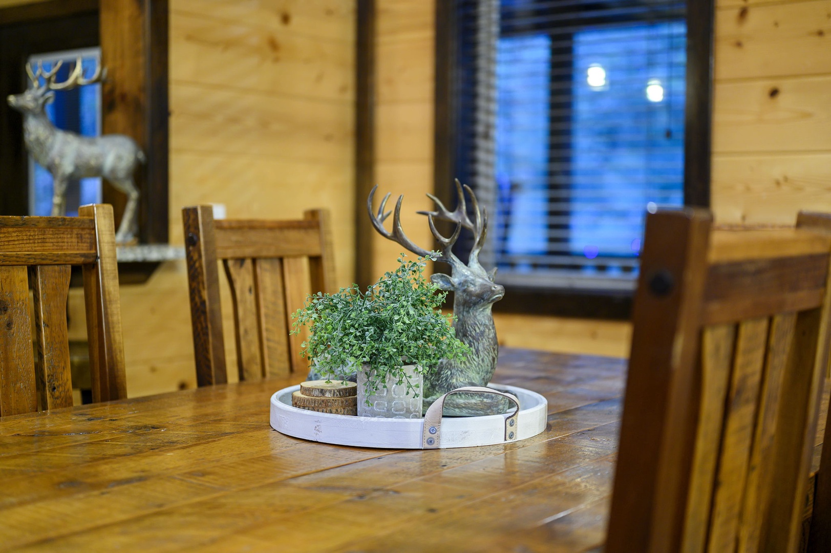 Gather around rustic wooden tables where charming woodland décor sets a warm, inviting tone for your mountain retreat meals and conversations.