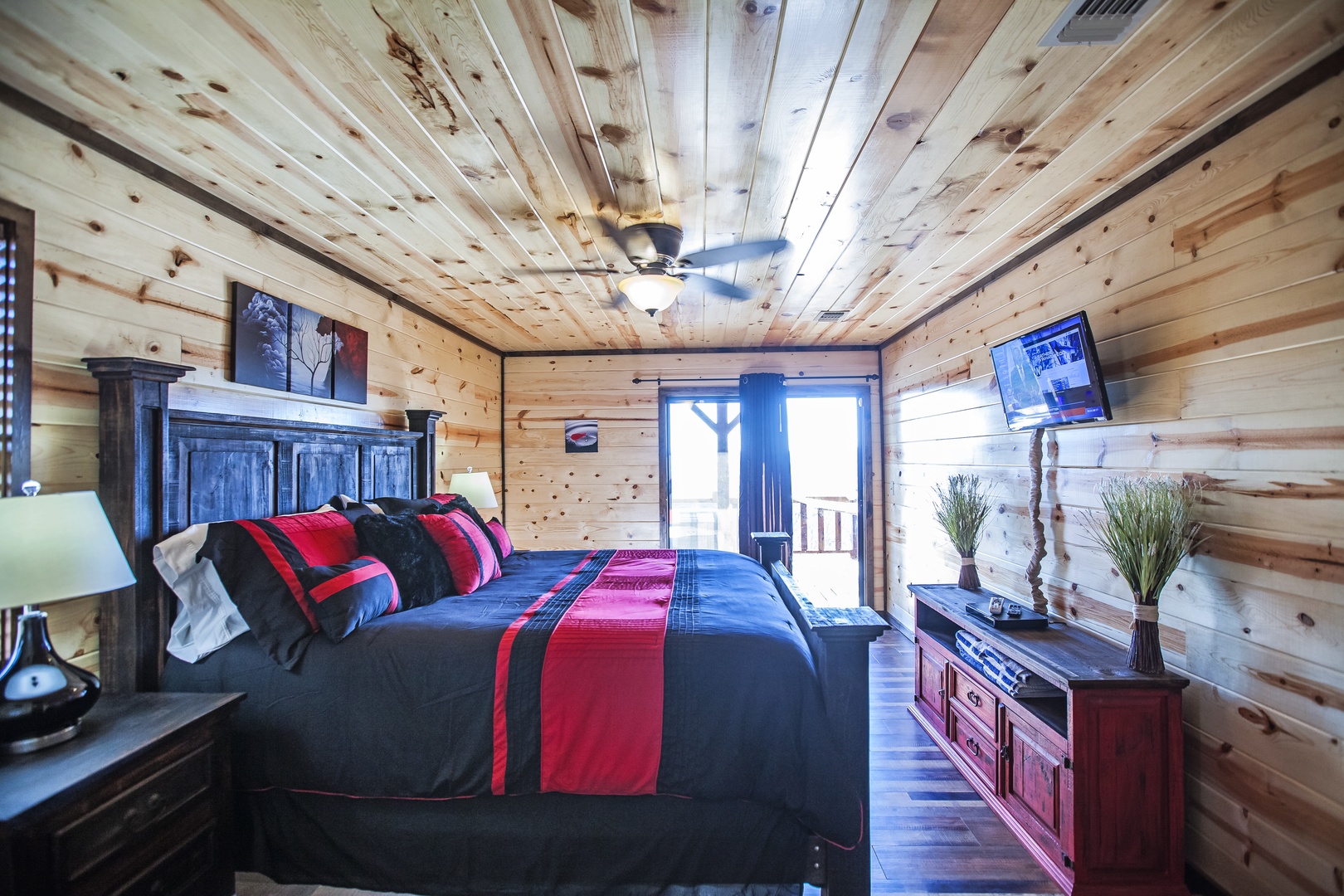 Rest in this cozy log cabin bedroom with rustic charm and modern comforts for your mountain getaway.
