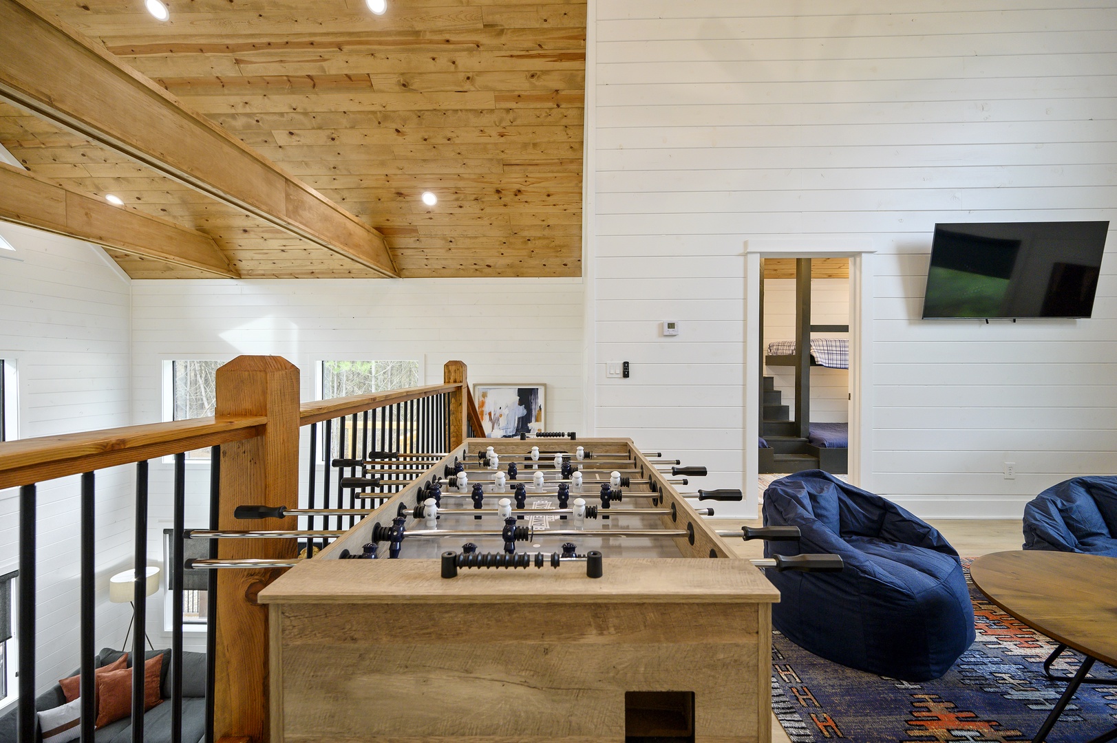 Challenge friends to foosball in your spacious game loft with soaring wood ceilings and cozy bean bag seating.