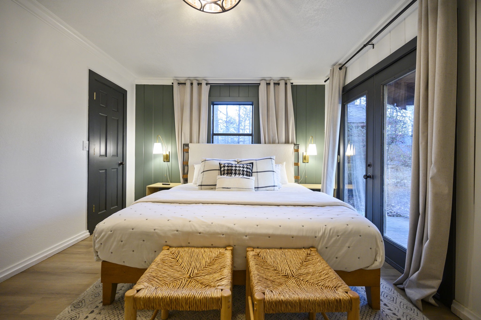 Sink into crisp white linens in this thoughtfully designed bedroom, where warm wood tones and soft lighting create your perfect retreat.
