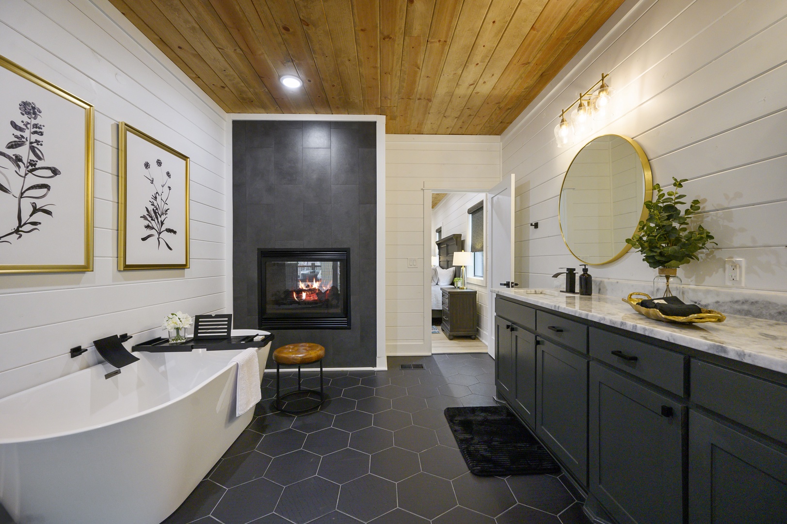 Soak in luxury with your own fireplace-warmed bathroom, featuring a stunning freestanding tub and spa-like marble vanity.