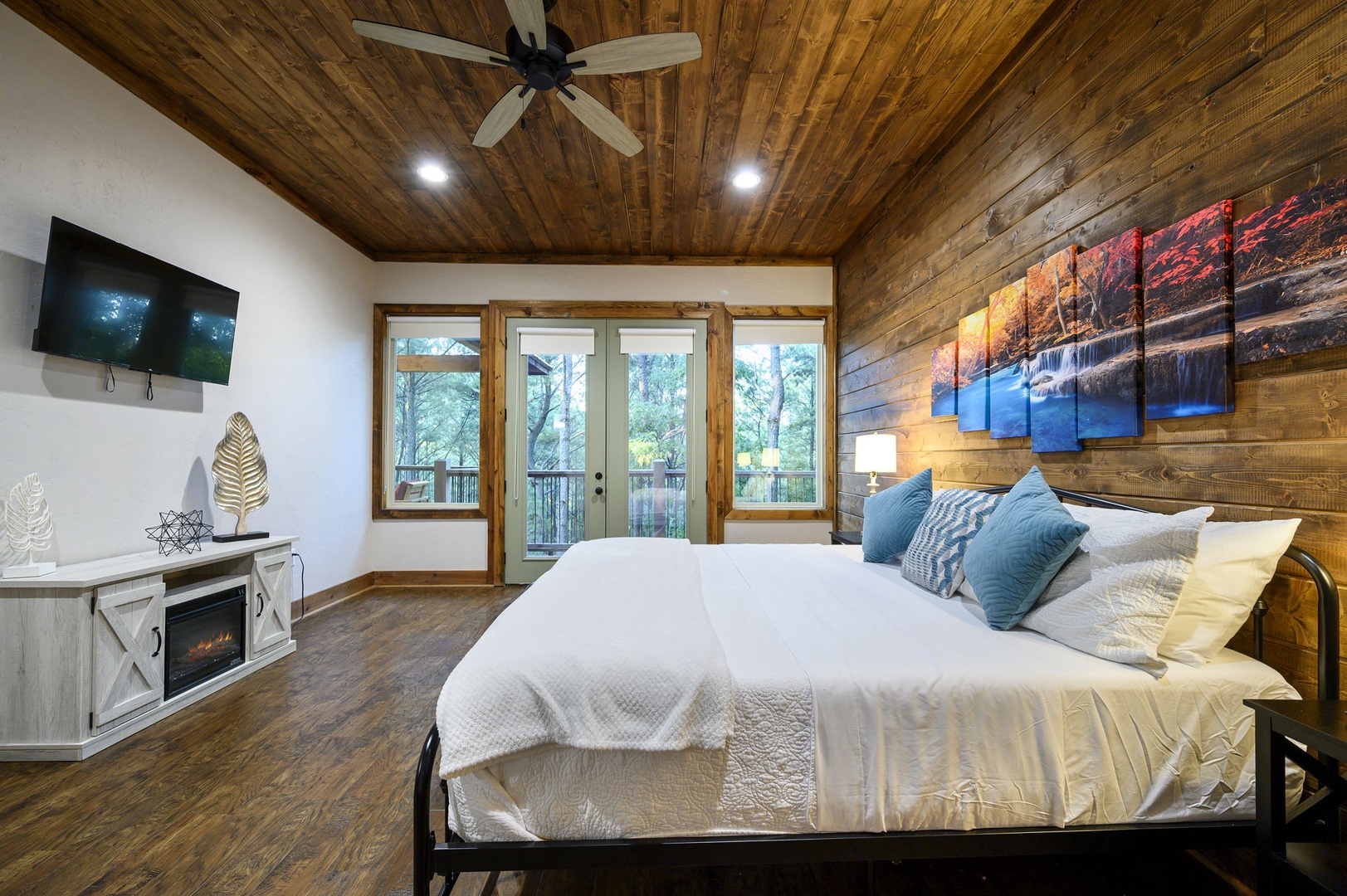 Sink into crisp linens and take in the serene forest views from your private suite. Warm wood accents and thoughtful touches—like the cozy fireplace—make this your perfect retreat.