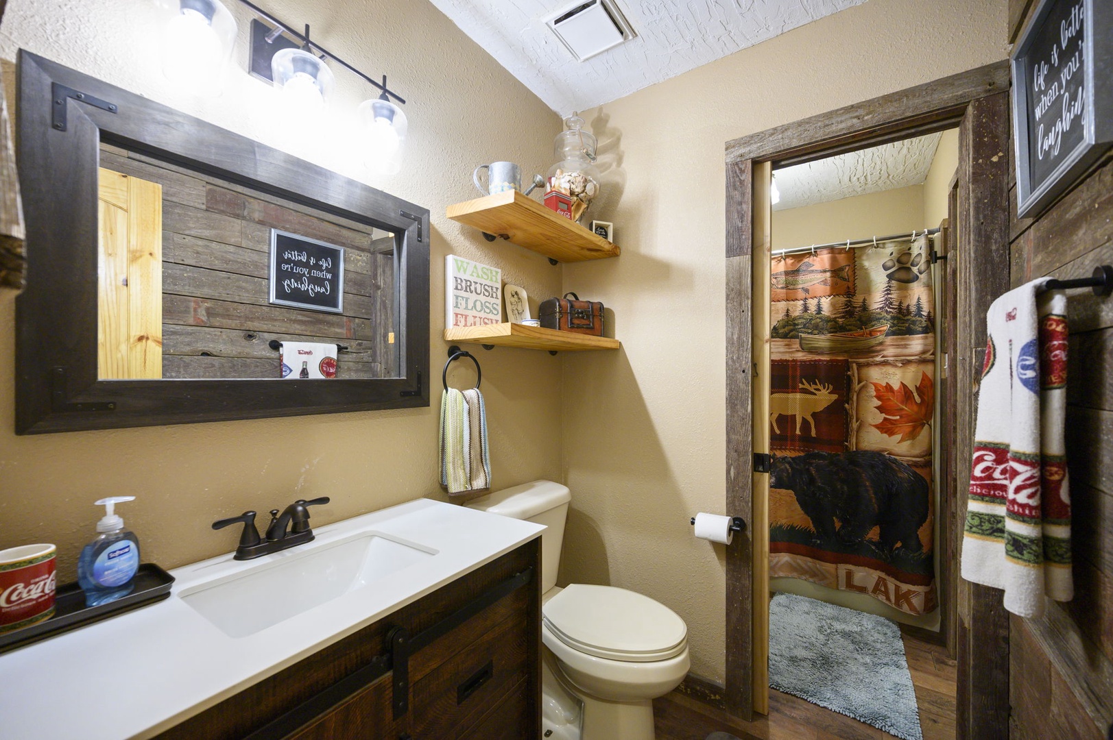 Freshen up in your charming rustic bathroom with authentic wood accents and cozy woodland décor that creates a warm cabin atmosphere.