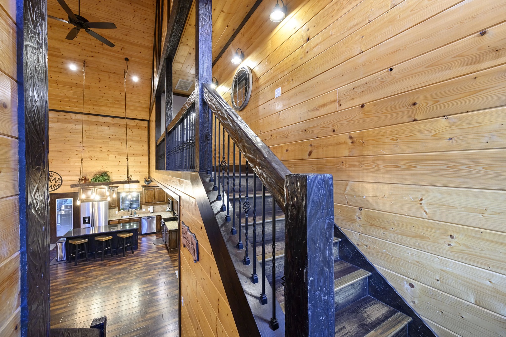 Soaring ceilings and rich wood beams create a stunning entrance to your mountain retreat, where rustic elegance meets modern comfort in every detail.