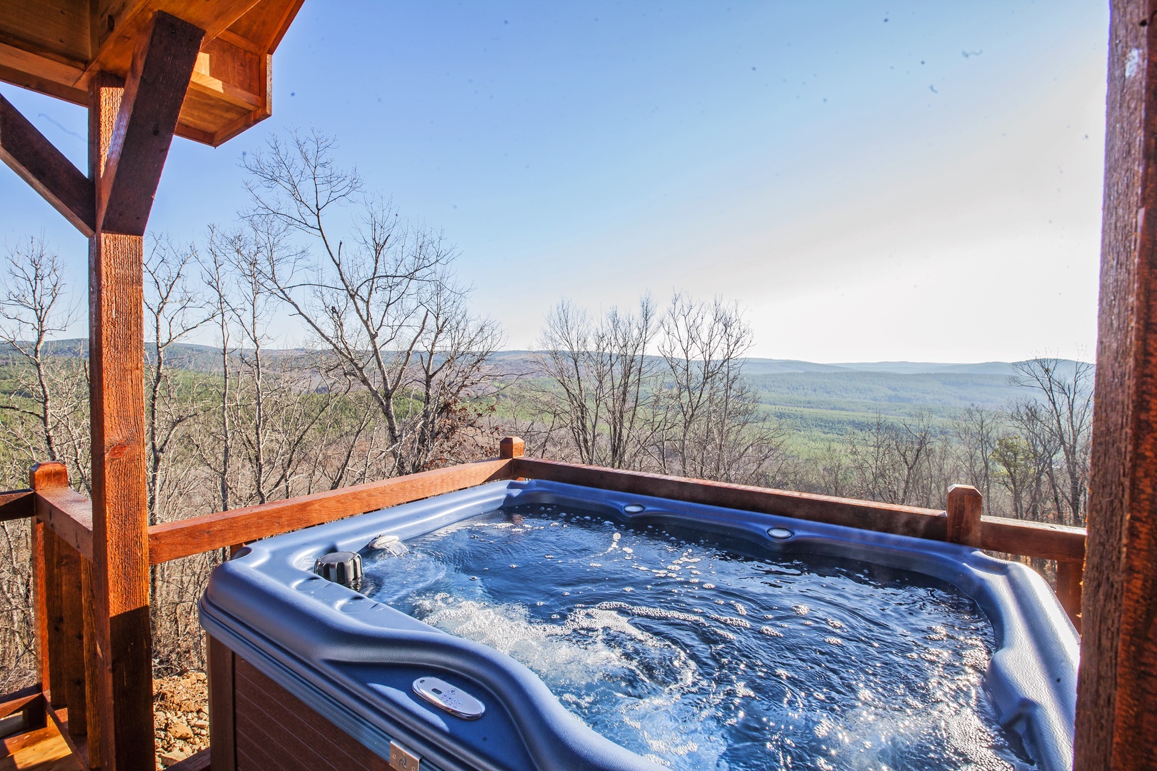 Soak in your private hot tub while taking in breathtaking mountain vistas that stretch endlessly before you.