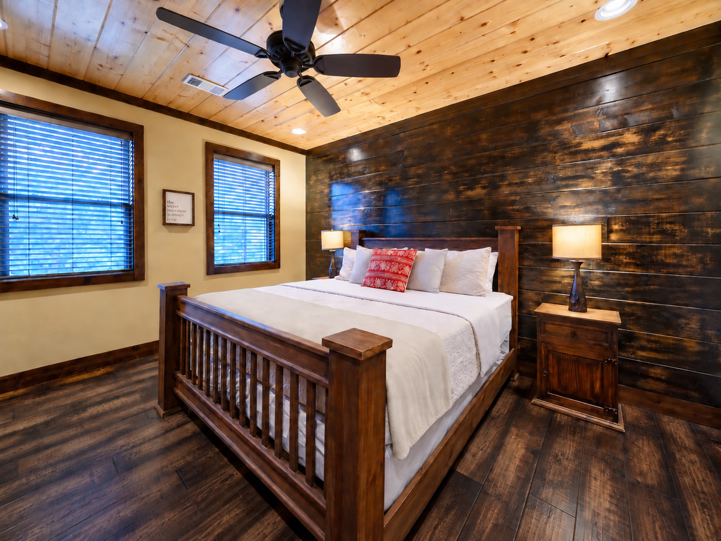 Unwind in your cozy bedroom where rustic wood meets modern comfort. Sink into crisp linens, let the ceiling fan keep you cool, and wake refreshed for your next adventure.