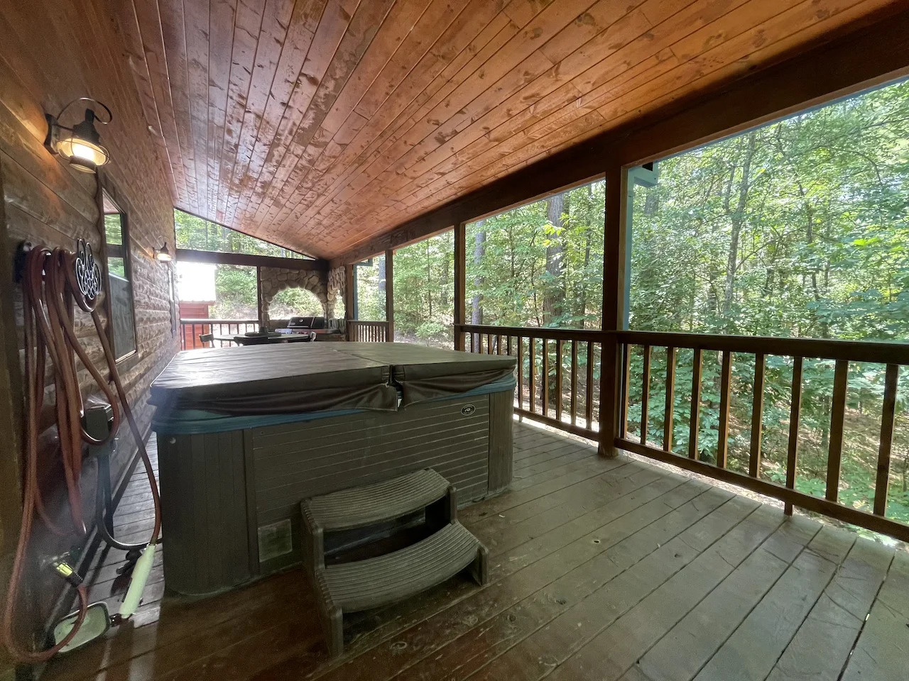 Slip into the hot tub and let the forest embrace you. The rustic wood deck, lush greenery, and peaceful ambiance create your perfect retreat for unwinding after a day of adventure.
