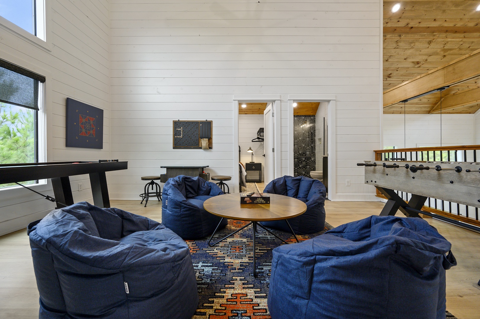 Sink into oversized bean bags around the cozy coffee table where you'll gather for game nights and conversations in this inviting lounge space.