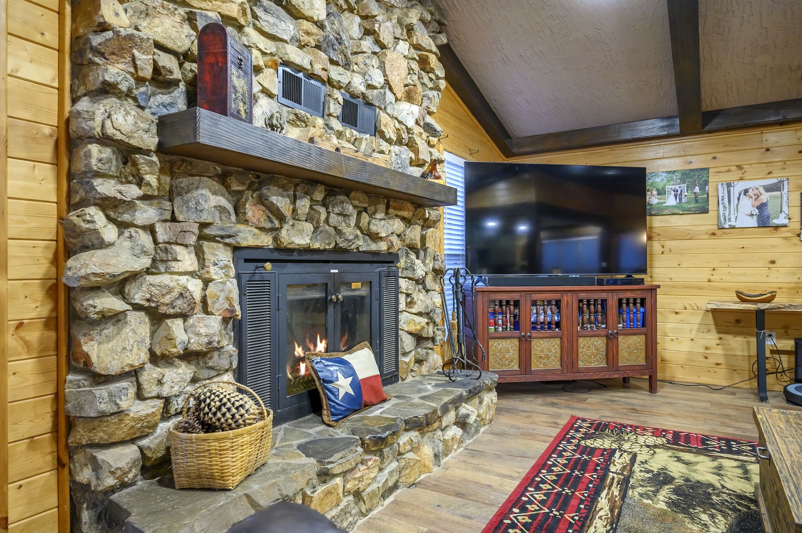 Watch your favorite shows on the flat-screen TV in this rustic living room. Please note that the fireplace is not available for guest use.