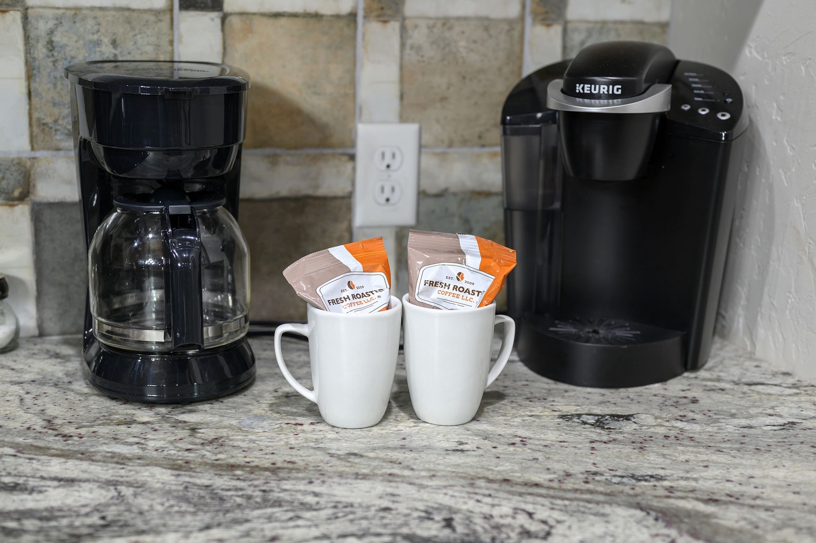 Start your mornings right with freshly brewed coffee from the Keurig or classic drip coffee maker, set up and ready for you on the granite countertop.