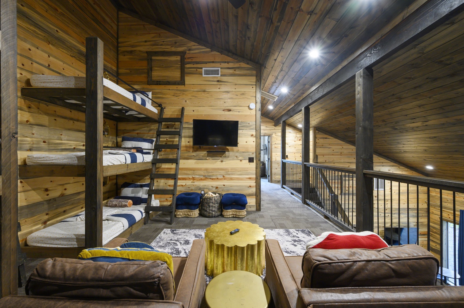 Your cozy loft retreat features custom bunk beds wrapped in warm wood, perfect for gathering with family or friends. Sink into the lounge seating under soaring timber ceilings and enjoy your own private hideaway.