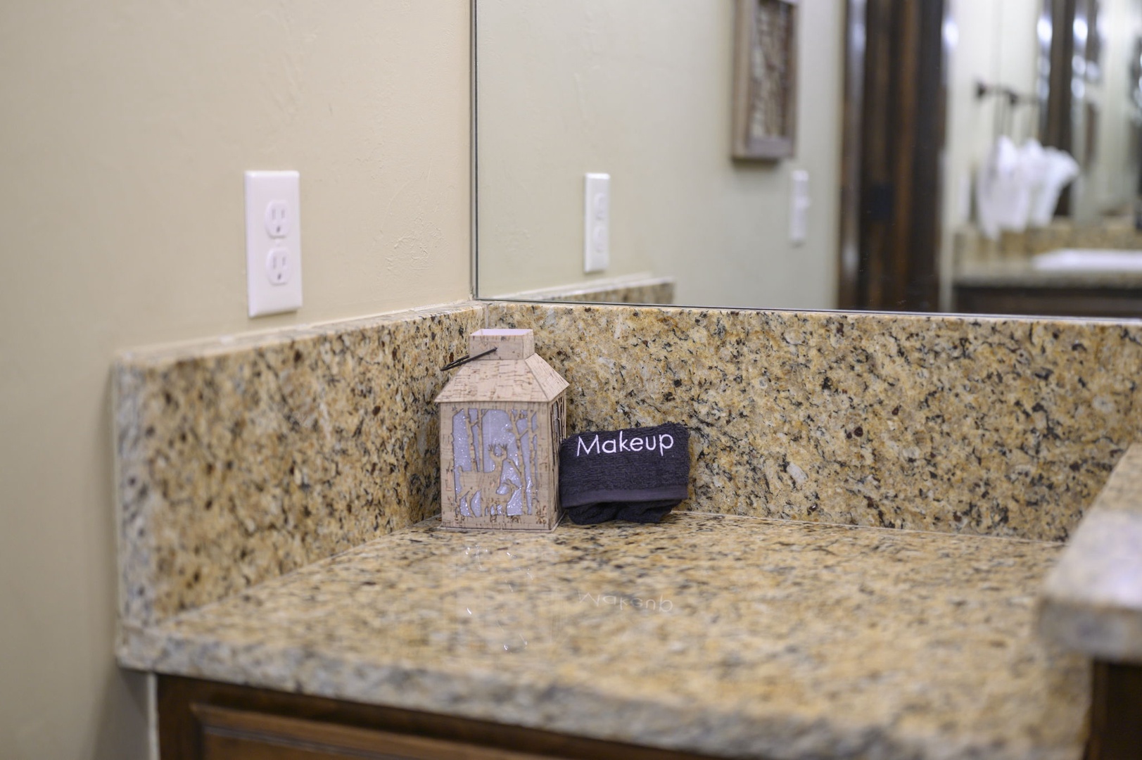 Freshen up at your private granite vanity with thoughtfully placed amenities, including plush towels ready for your arrival.