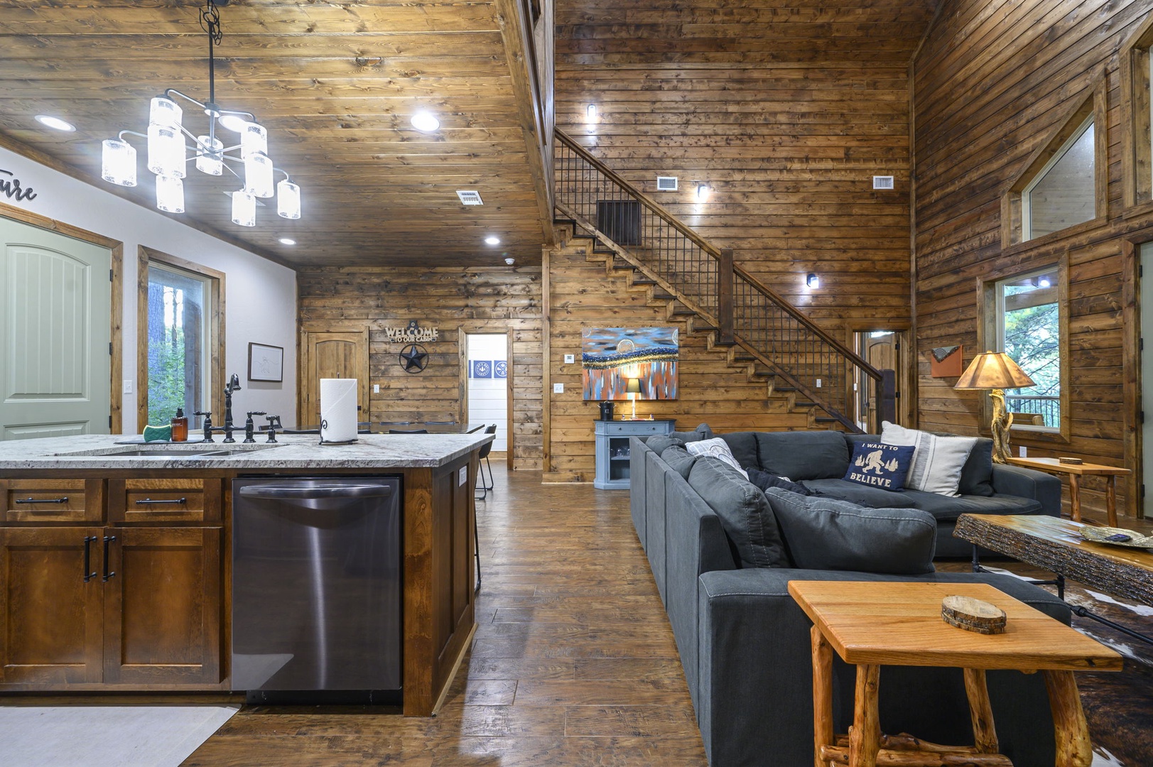 Step into this warm, inviting space where rustic wood and modern comfort meet. Your mountain getaway features soaring ceilings, a cozy living area, and an open kitchen with everything you need to make yourself at home.