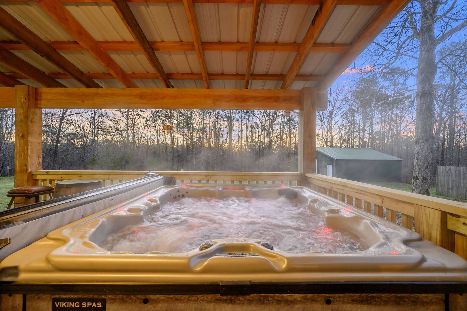 Soak away your stress in this private hot tub with forest views, where warm bubbles and nature's tranquility create your perfect evening retreat.