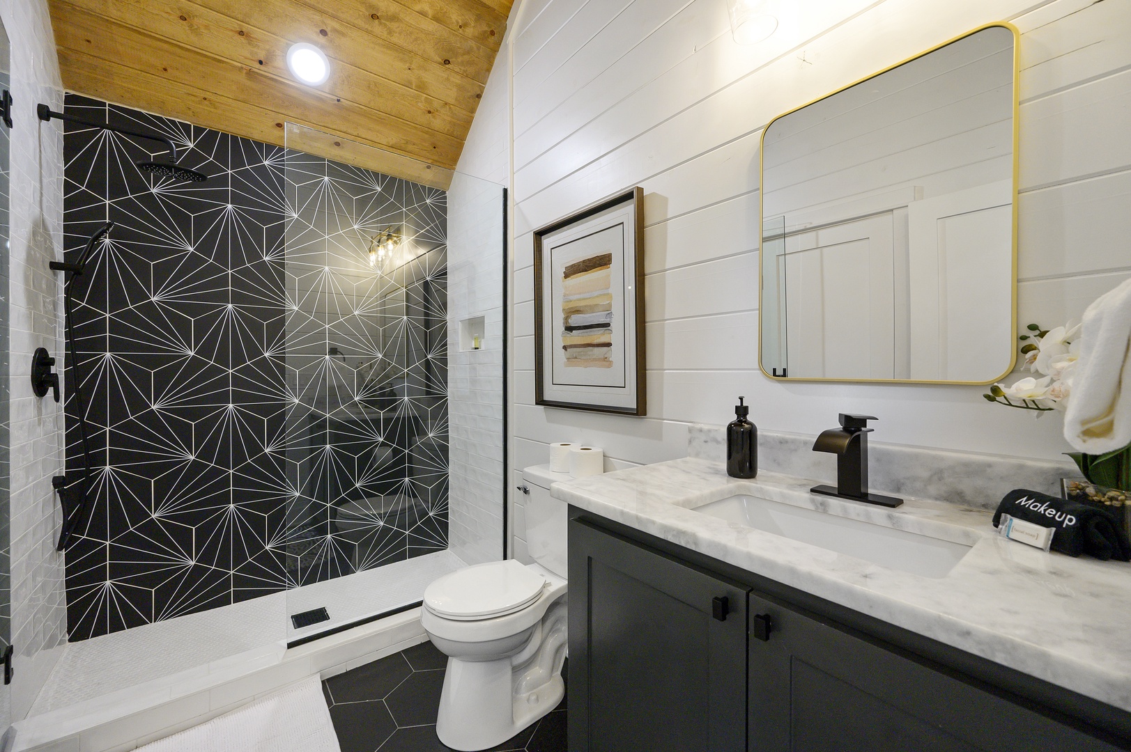 Step into your stylish bathroom featuring stunning geometric tile, marble counters, and modern fixtures that make your daily routine feel luxurious.