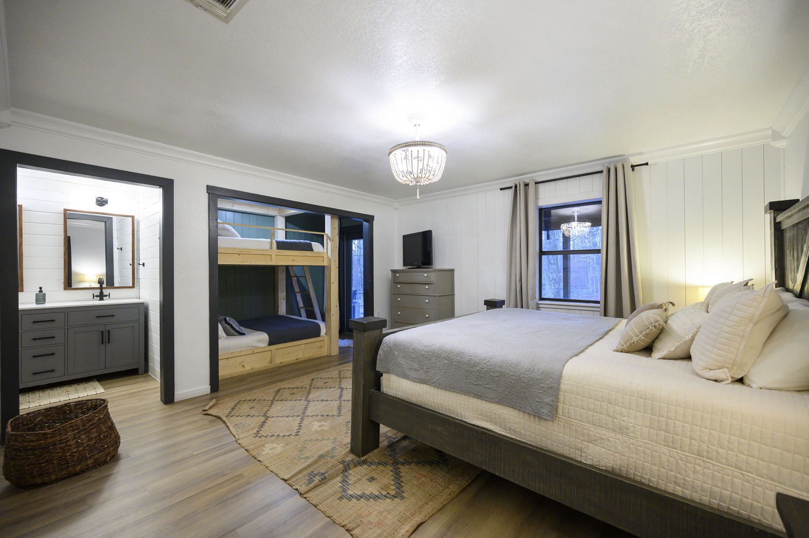 Drift off to sleep in your spacious bedroom featuring a comfortable queen bed, built-in bunks for extra guests, and elegant touches throughout.