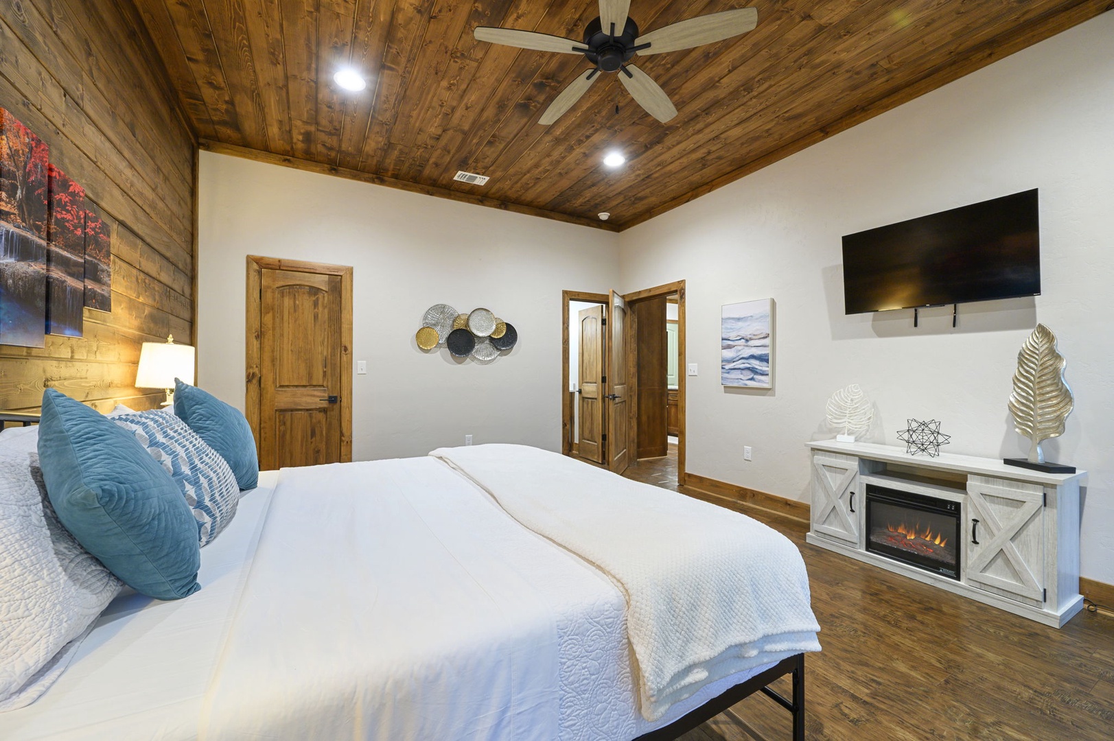 Your rustic yet refined retreat awaits, complete with vaulted wood ceilings, a plush bed, and a cozy fireplace to warm your evenings after a day of exploring.