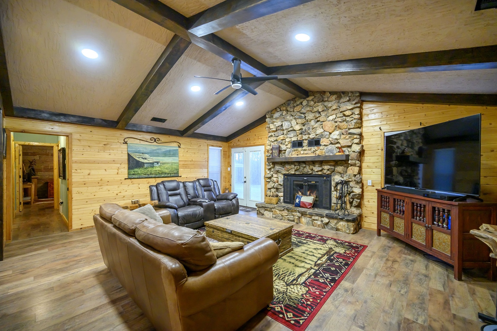 Sink into plush leather seating, where rustic charm meets modern comfort in this inviting retreat. Please note that the fireplace is not available for guest use.