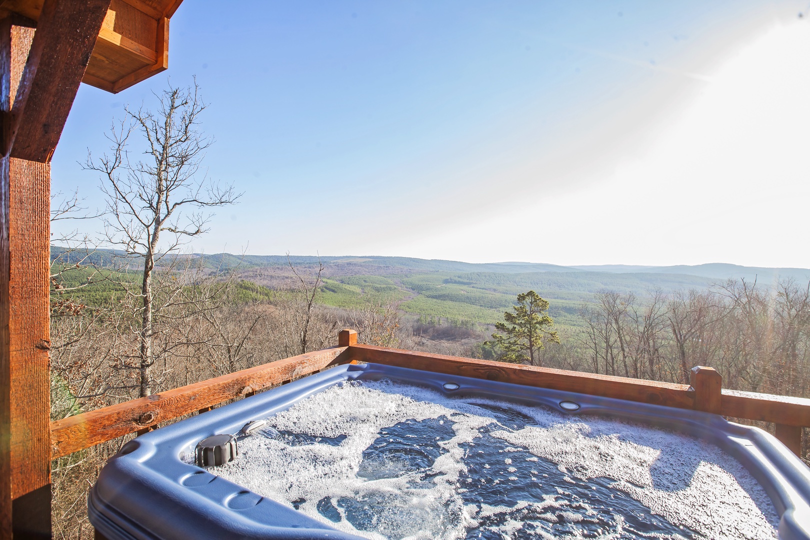 Soak in bubbling waters while taking in sweeping mountain vistas from your private hot tub sanctuary.