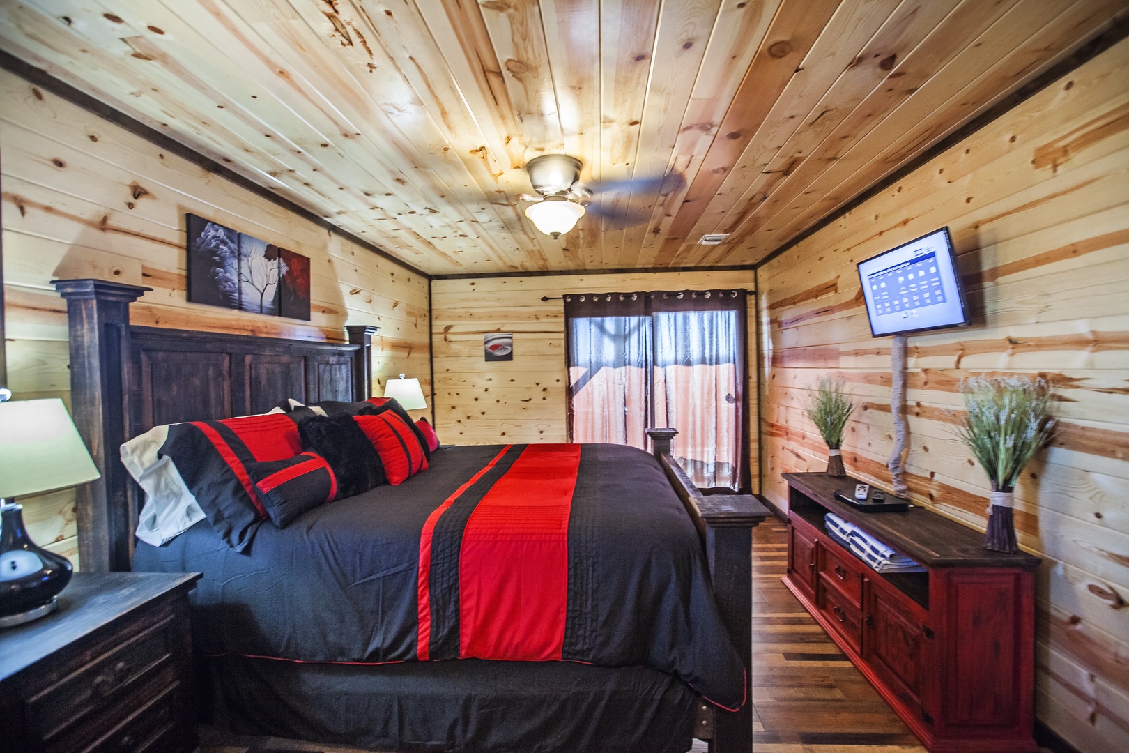 Snuggle into your rustic retreat with warm wood walls surrounding your cozy bed and modern amenities for the perfect mountain getaway.