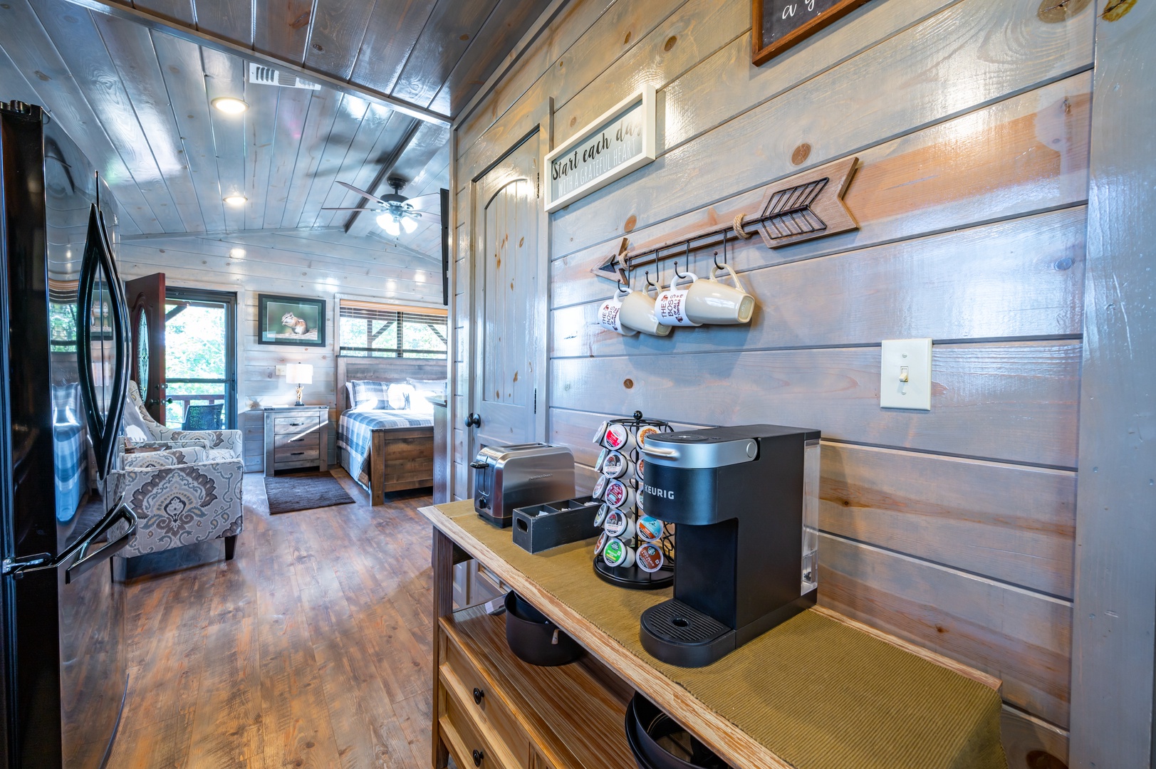 Enjoy your morning brew at the rustic coffee station, perfectly positioned between cozy living space and peaceful bedroom retreat.