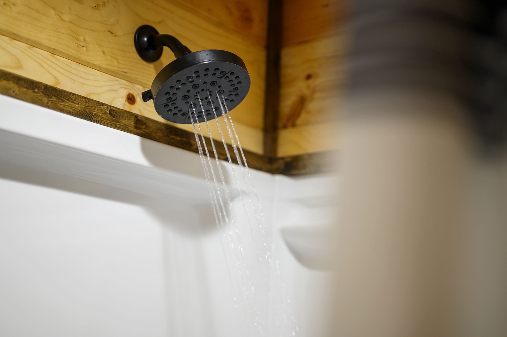 Rinse away the day under a refreshing rain shower in your private bathroom, complete with stylish fixtures and warm wood accents overhead.