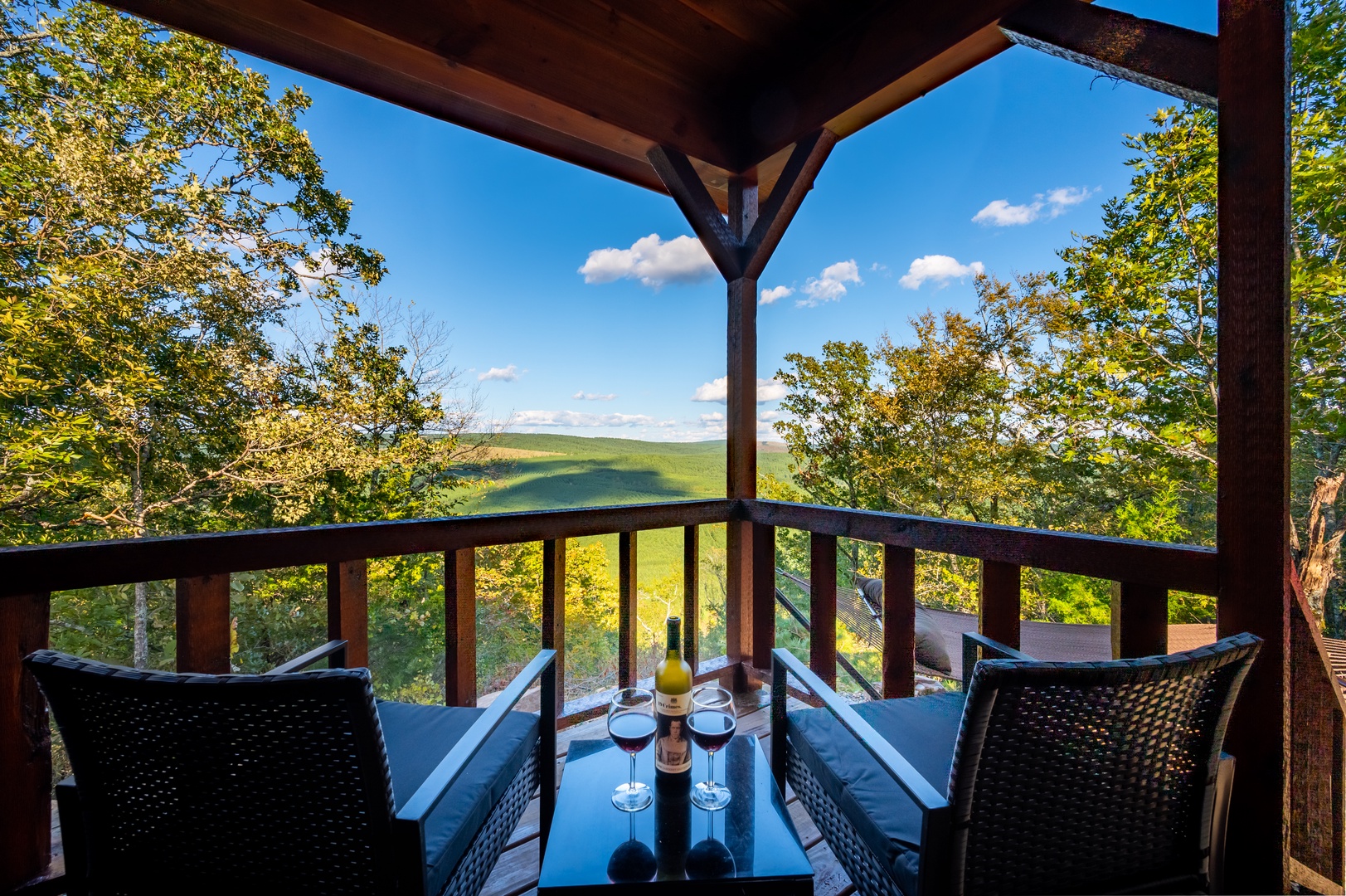 Unwind on your private covered terrace with panoramic mountain views, where every meal becomes a scenic experience surrounded by rolling green hills.