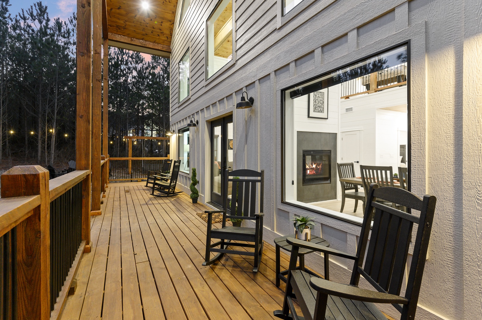 Settle into your private deck chairs as evening lights twinkle, perfect for unwinding with nature views.