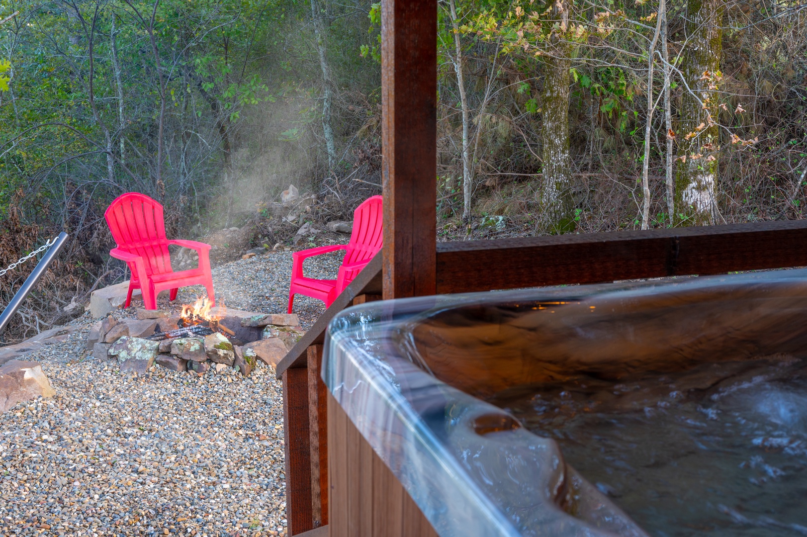 Soak in bubbling warmth while your fire crackles nearby, surrounded by peaceful forest views.