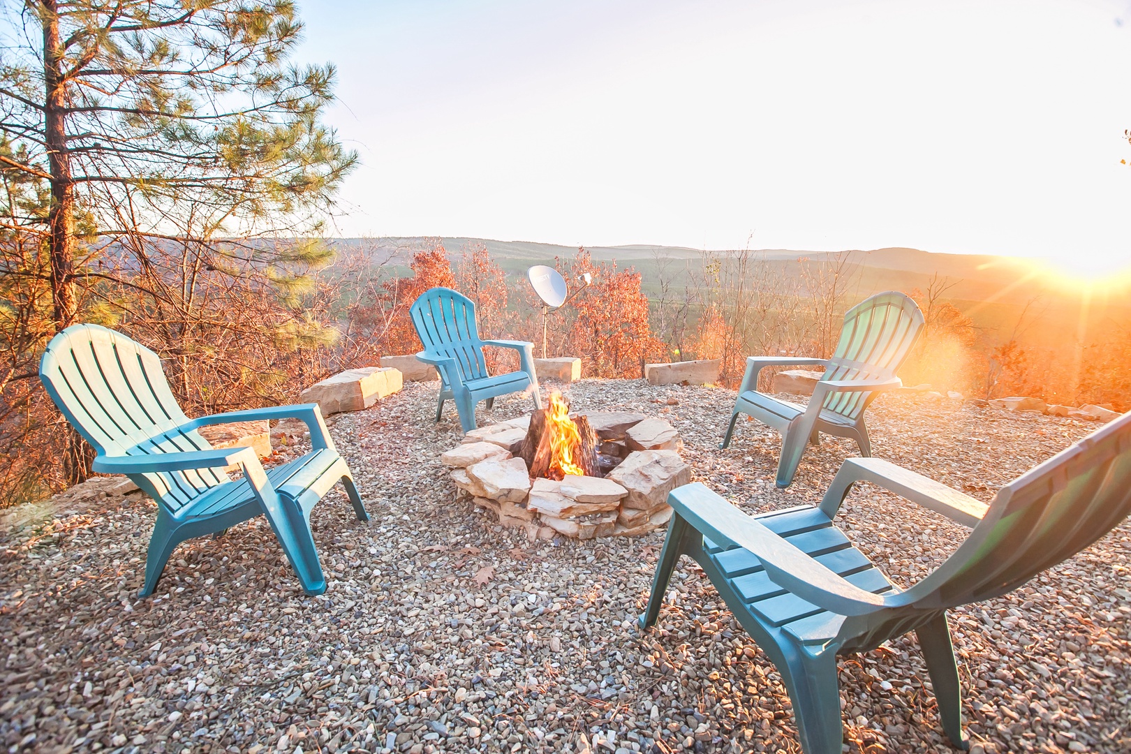Watch the sun set over rolling hills from your private fire pit, surrounded by cozy Adirondack chairs perfect for evening conversations.