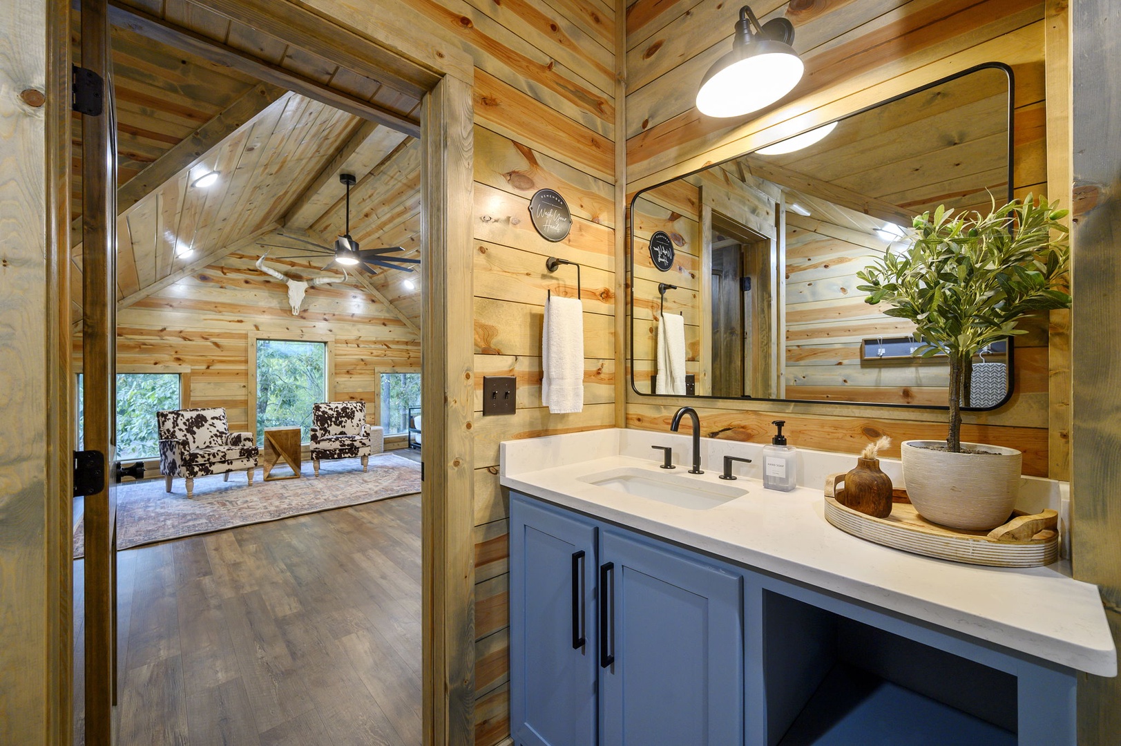 Step into your private bathroom retreat, where warm wood tones and modern fixtures create a perfect blend of rustic charm and contemporary comfort.