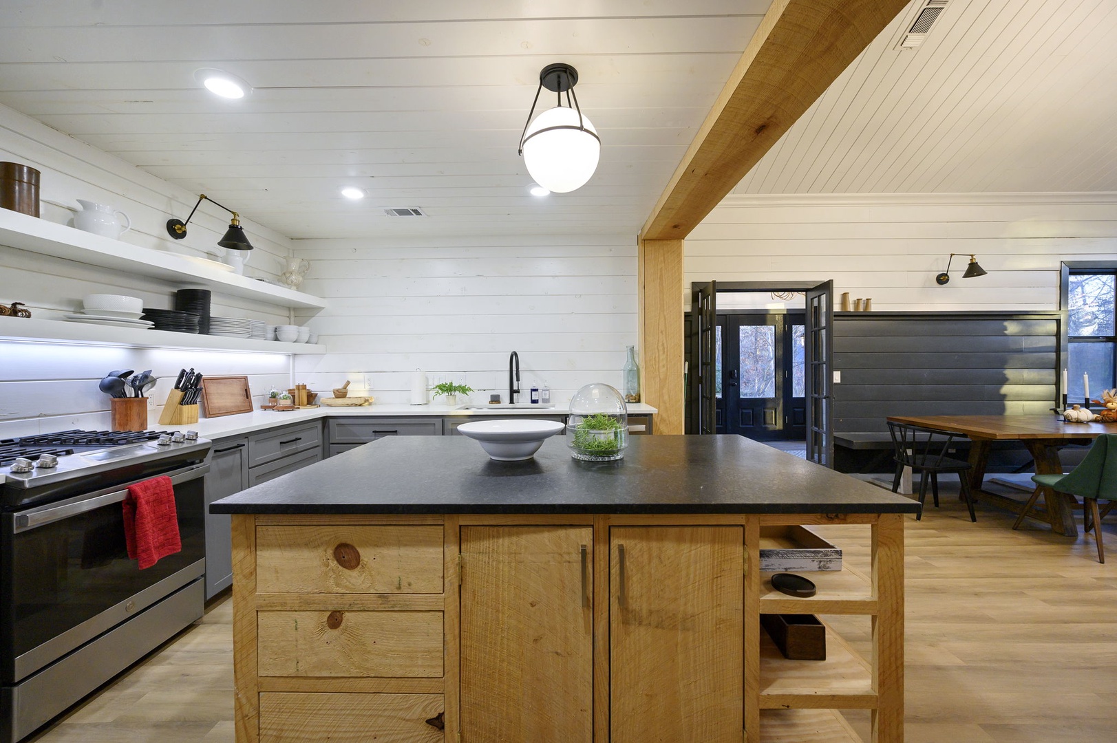 Your dream chef's kitchen awaits with spacious counters, premium appliances, and a stunning wood island perfect for cooking memorable meals together.