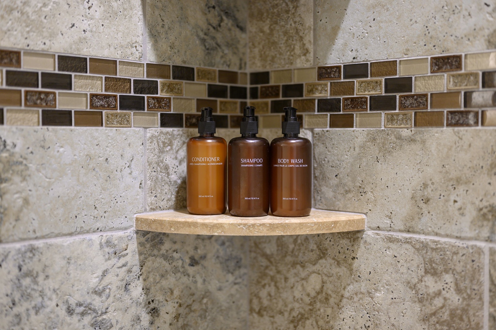 Luxurious complimentary toiletries await you in your beautifully tiled shower, combining practicality with a spa-like touch to help you unwind and refresh during your stay.