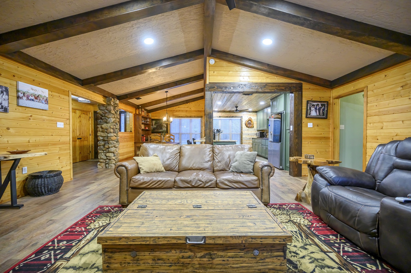 Sink into plush leather seating surrounded by warm wood walls and beamed ceilings, where your mountain retreat feels like home.