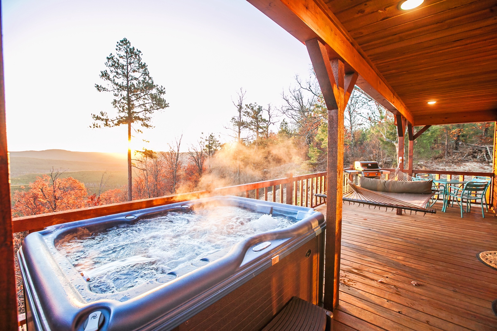 Soak in the steaming hot tub while watching autumn colors paint the mountain landscape at sunset from your private deck.