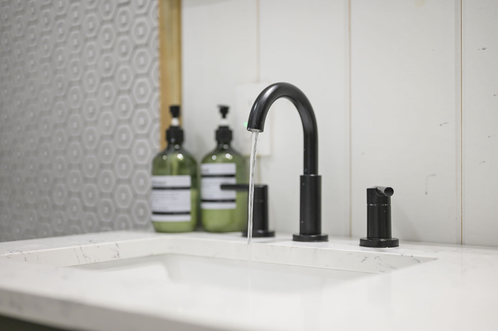 Refresh in your stylish bathroom featuring sleek fixtures and quality amenities for your comfort.