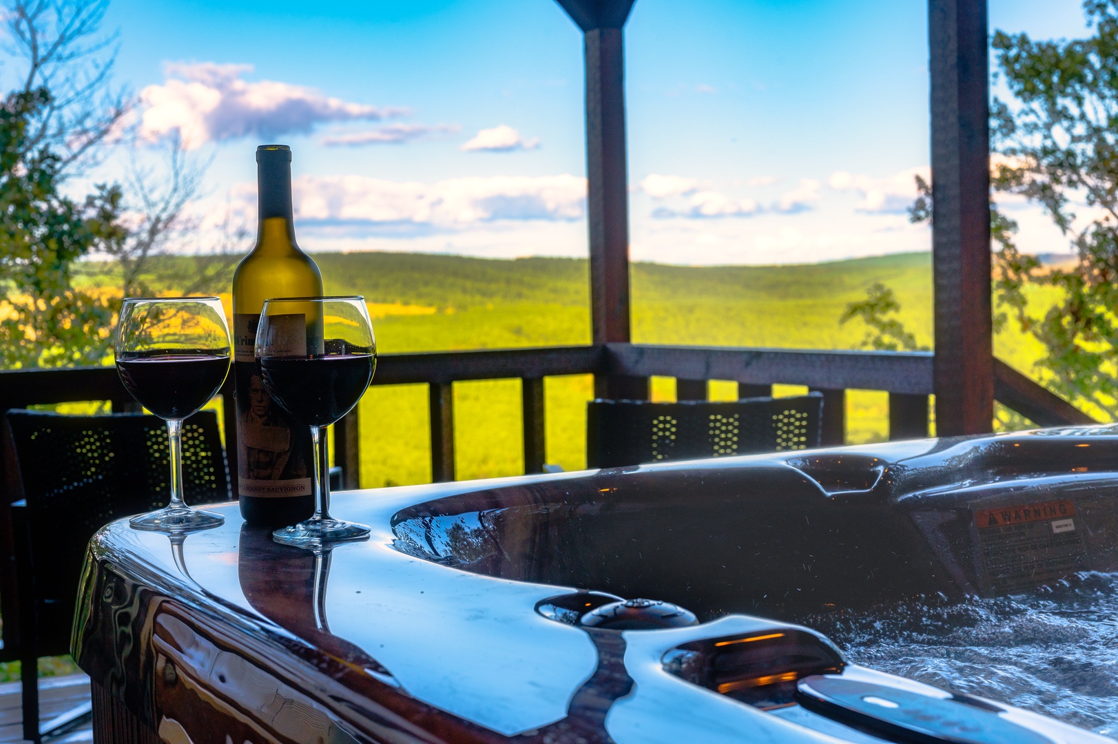 Unwind in your private hot tub with wine as golden fields stretch endlessly before you under a painted sky.