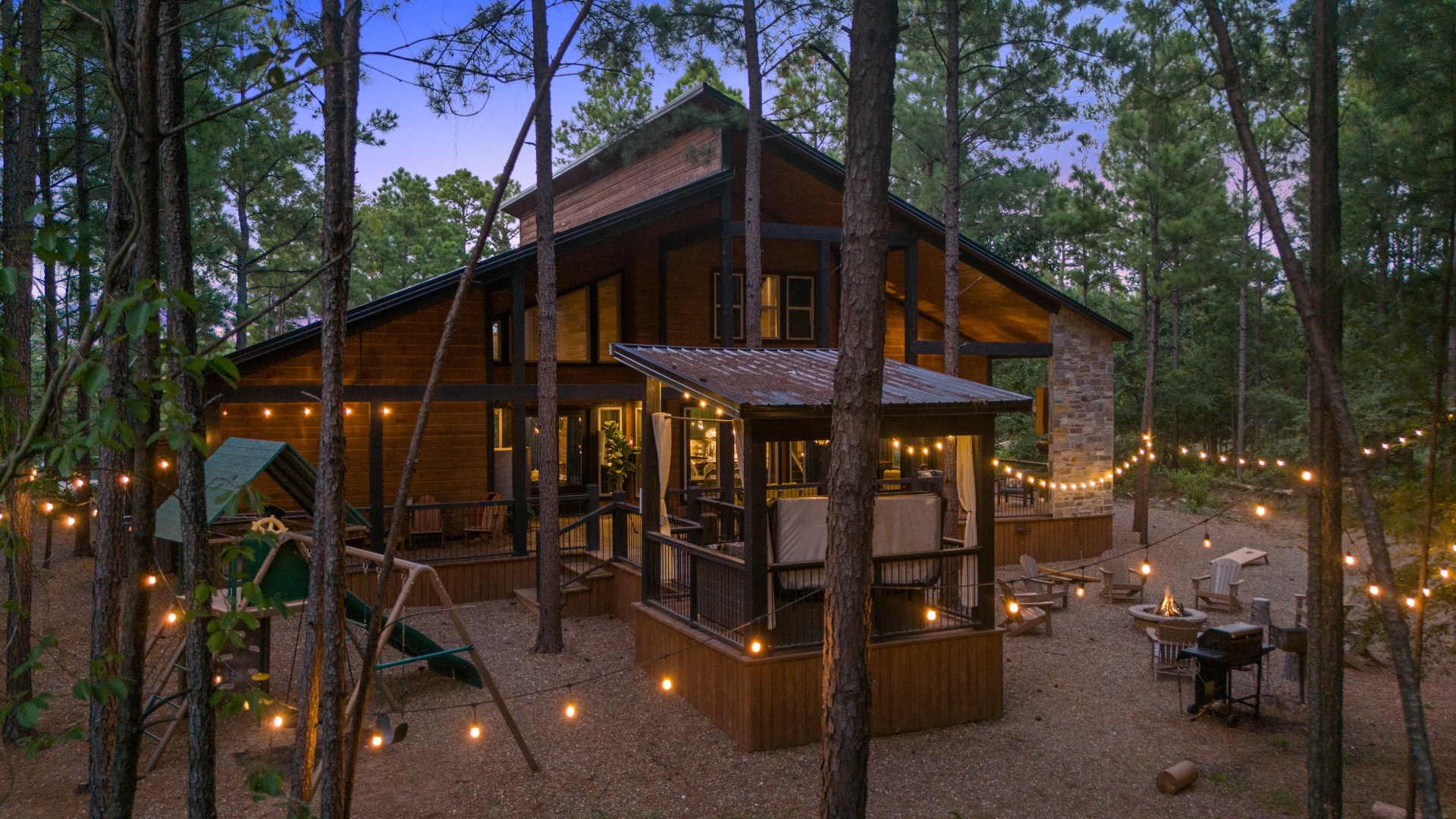 A beautiful woodland retreat nestled among towering pines, where twinkling lights create a magical atmosphere for your evening gatherings.