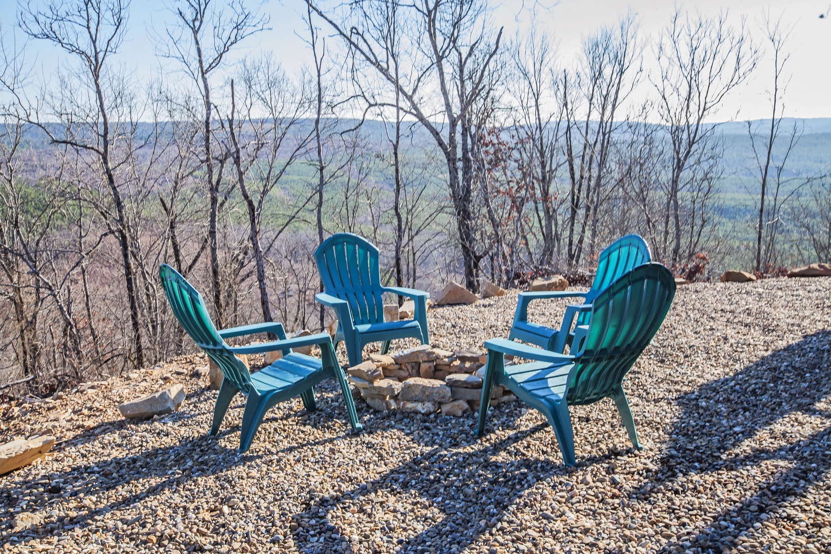 Comfortable Adirondack chairs surround your private fire pit, creating the perfect spot to unwind while taking in stunning mountain views.